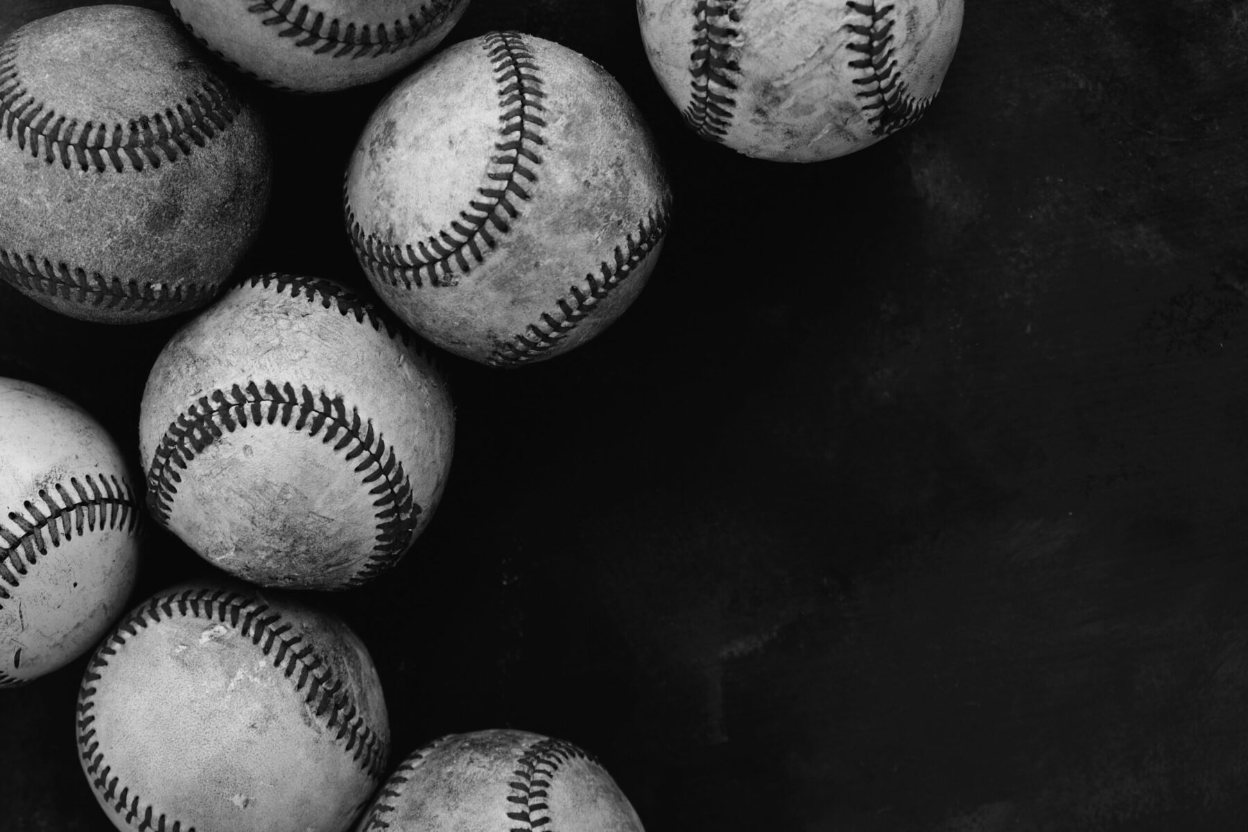 Dark baseball background with old used balls for sport in black Gildan Youth 50/50 Tee